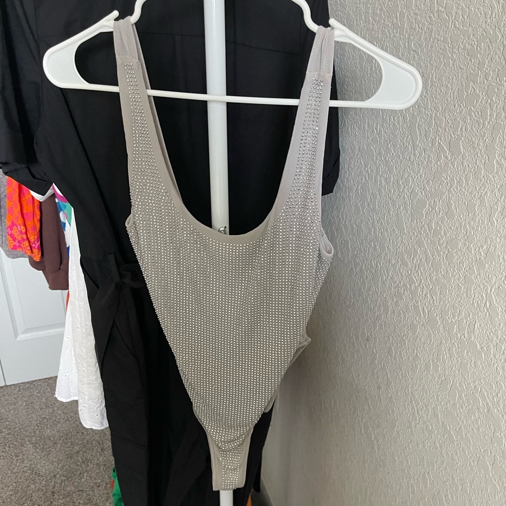 I don't use it anymore and it's in good condition.Zara Body with glitter, size M